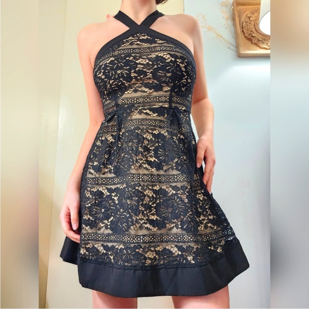 Francesca’s black lace dress